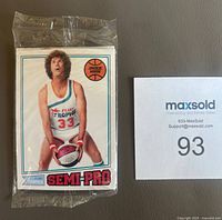 Front of sealed pack showing Jackie Moon card