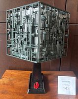 Front angled view of Borg Cube on stand showing detailed surface and stand