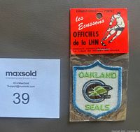 Front of sealed Oakland Seals patch with orange header card