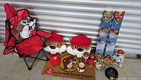 Full group shot of all Buc-ee's items including chair, pillows, kites, mat, drinkware and pet supplies