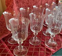 Group of clear crystal goblets on red fabric