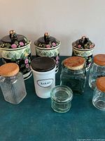 All items overview—three ceramic canisters and five glass jars