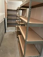 View down aisle showing three matching shelving units