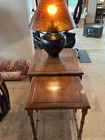 nested tables with lamp on top, overall view