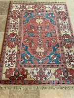 Full view of Karastan wool area rug showing pattern, fringe and overall condition