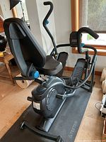 Full view of Teeter FreeStep LT3 machine on branded mat