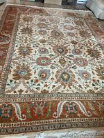 Full view of Persian floral rug showing overall design and colours