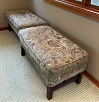 Two matching rectangular paisley ottomans side by side