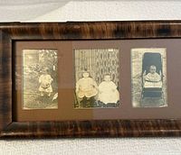 Wood frame with three sepia child photos