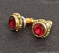 Both earrings front view showing stones and gold settings