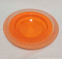 Top view of orange art glass bowl