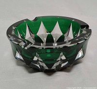 Oblique view showing emerald overlay and cut facets