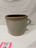 Side view showing full chamber pot and handle