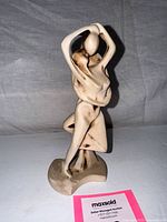 Front view of soapstone kissing couple figurine