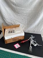 Opener, box with foam insert shown together