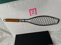 Basket closed showing full fish shape and handle