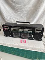 Front view of Fisher PH-463 boombox showing speakers, cassette deck, equalizer, tuner and handle