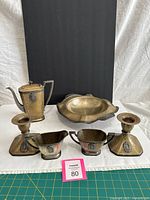 Full set showing all six hammered bronze pieces