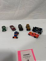 Seven vehicles laid out overhead view