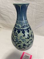 Full front view showing blue-and-white motifs and baluster shape