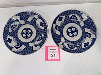 Top view of both blue and white Imari plates showing pattern and overall condition