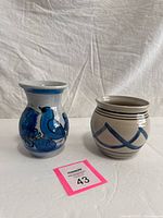 Front view of both stoneware vessels