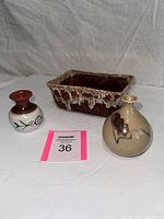 Front view of all three pottery pieces