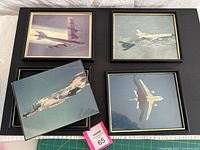Overview of all four framed photographs on display board