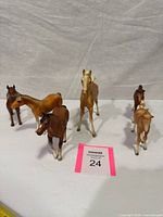 Front view of six assorted horse figurines