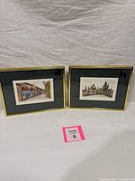 Both framed prints side by side