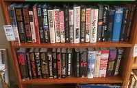 Full view of two shelf rows showing majority of hardcover novels