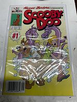 Front cover of Scooby-Doo #1 comic in protective sleeve