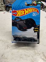 Front view of sealed Hot Wheels Batmobile on card backing