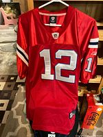 Front view showing number 12, NFL shield, Reebok branding