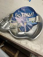 Pan with blue insert partially attached