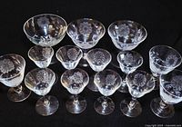 All 14 Cornflower crystal pieces grouped on black background