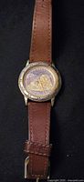 Front view Citizen Alaska sea otter watch with brown leather strap