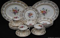 Group view of full 23-piece Alfred Meakin Golden Posy china service