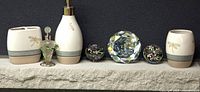Full lot showing ceramic bath set, two trinket boxes, crystal paperweight, perfume bottle