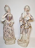 Front view of both Rococo porcelain figurines