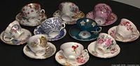All ten teacup and saucer sets displayed together