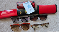 Group shot of 5 eyeglasses and 4 cases displayed
