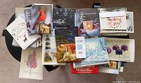 Top view of assorted greeting cards stacked on table
