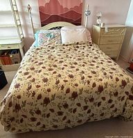 Bed assembled showing headboard, mattress and bedding