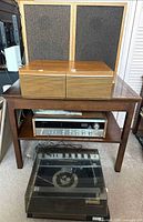 Full lot: speakers on table, CD holder, receiver, turntable on floor