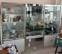 Front view of all three modular display cabinets filled with glassware (not included)