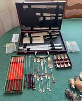 Overview of lot showing knife set, fondue forks, spoons and pie server