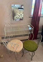 Vanity with attached mirror and two chairs, full set view