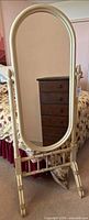 Front view of cream wooden cheval mirror