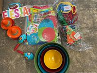 Group shot showing Fiesta sign, maracas, sombrero dishes, sealed decorations, nested bowls